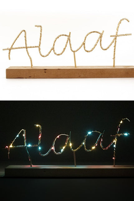 Scaffale con testo Alaaf illuminato